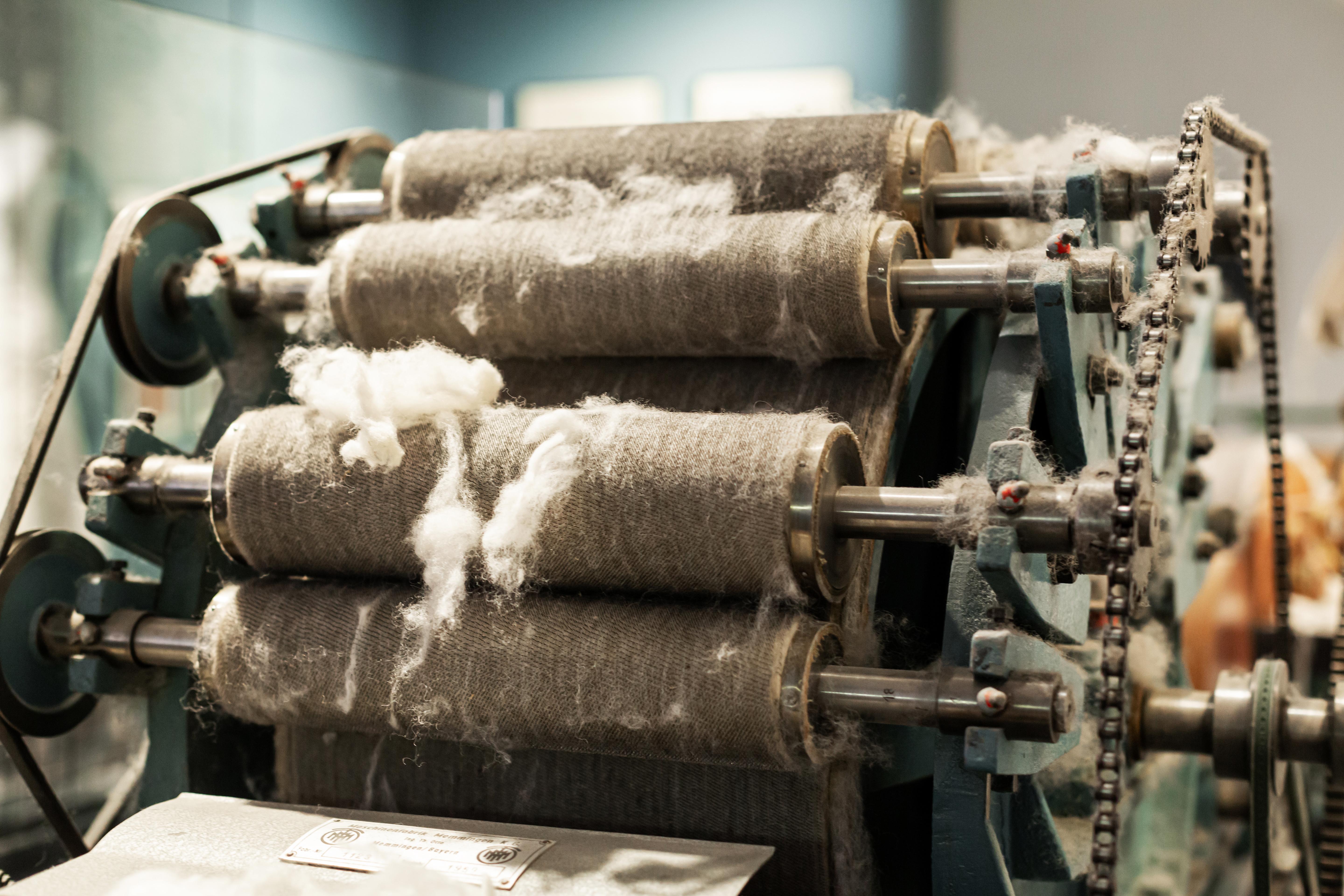 Close-up mechanism of a fiber processing machine, breaking down the plant.