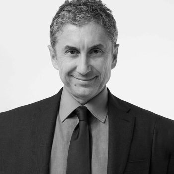 Portrait of Marco Gobbetti, CEO of Ferragamo, in black and white.